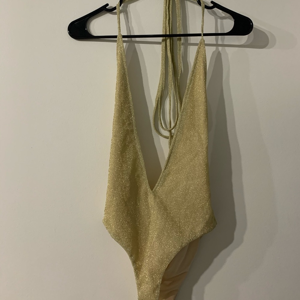 Gold sparkly body suit